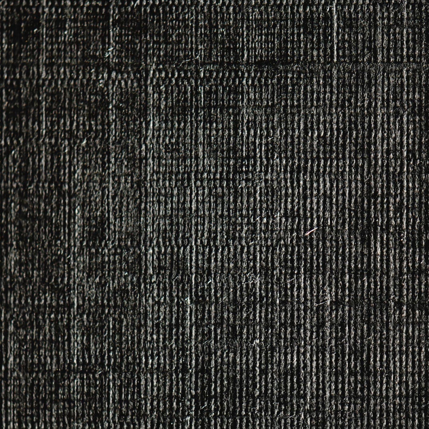 Close-up of charcoal cotton polyester blended fabric showing a fine, even surface