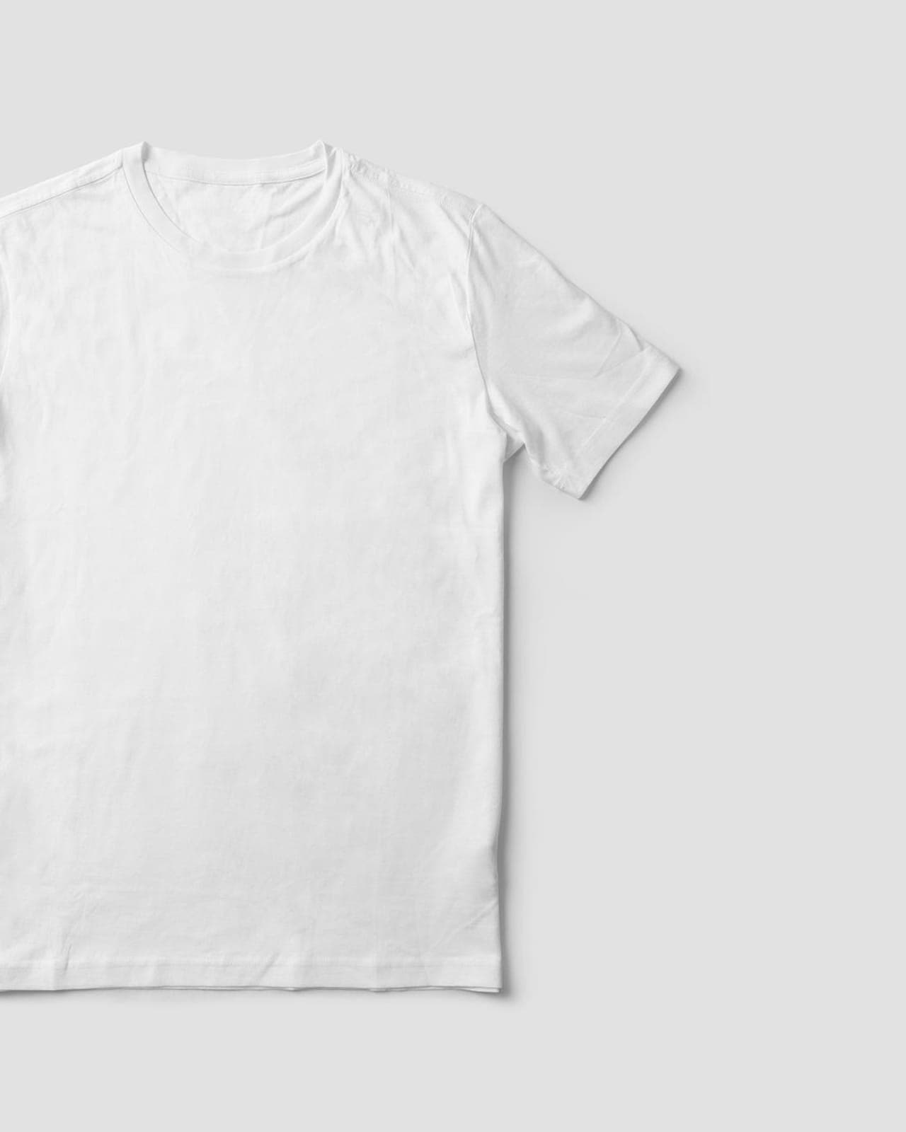 Plain white cotton T-shirt photographed flat on a neutral background